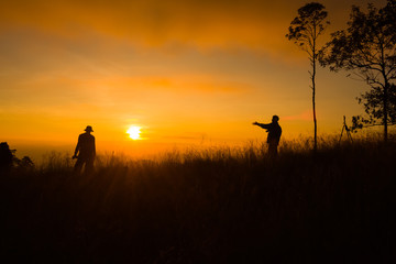 Silhouette of photography on the cliff