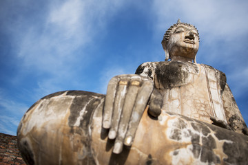 Obraz premium Ancient Buddha statue at Sukhothai historical park, Thailand.