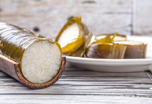 Malaysian traditional lemang dish on weathered wooden background