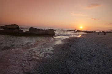 Obraz premium sunset summer - sea rocks