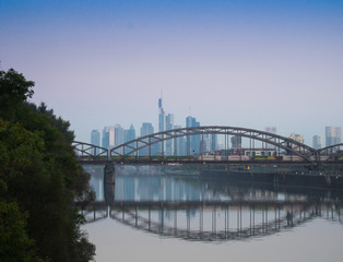 Railway bridge and the skyline of  Frankfurt, Germany