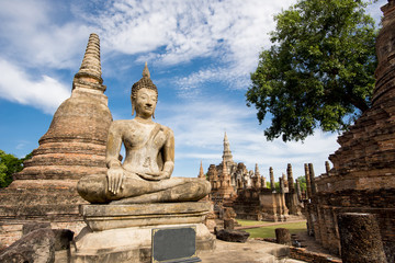 Fototapeta na wymiar Ancient Buddha Statue at Sukhothai historical park, Mahathat Temple ,Thailand.
