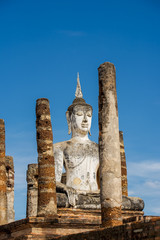 Fototapeta na wymiar Ancient Buddha Statue at Sukhothai historical park, Mahathat Temple ,Thailand.