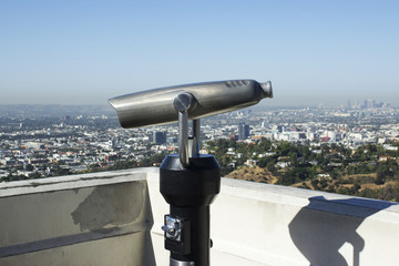 The city of Los Angeles serves as a backdrop to this coin operated telescope
