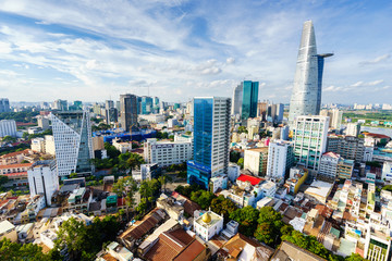 SAIGON, VIETNAM - JUNE 18, 2015. Ho Chi Minh city (or Saigon) skyline with colorful house in...