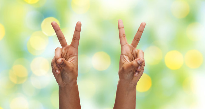 Two African Hands Showing Victory Or Peace Sign