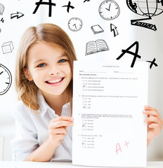 girl with test and A grade at school