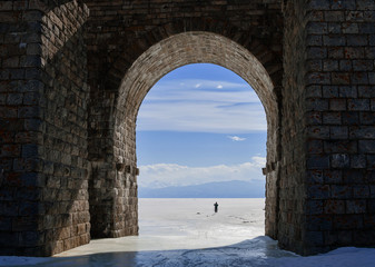 View of Lake Baikal through the arch of the railway bridge