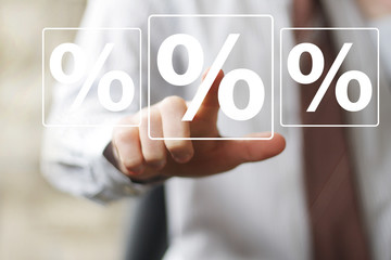 Businessman push virtual button percent sign