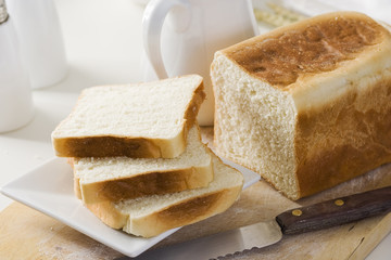Sliced bread on a wooden cutting board