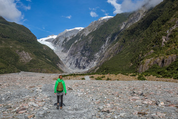 Fototapeta premium Woman Backpacker walking in Franz Josef Glacier