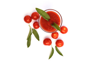 Glass of tomato juice with cherry tomatoes