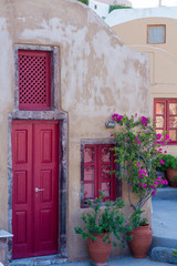 Fototapeta na wymiar colorfull doors in oia village, Santorini.
