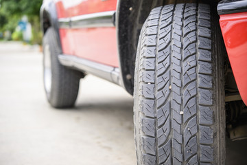 Naklejka premium Car tire on the road