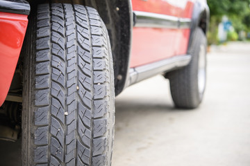 Naklejka premium Car tire on the road