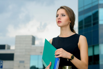 Business woman with folders for papers in her hands