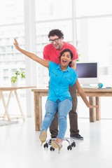 Smiling partners playing together with swivel chair