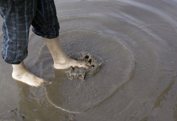 legs splatters mud puddle