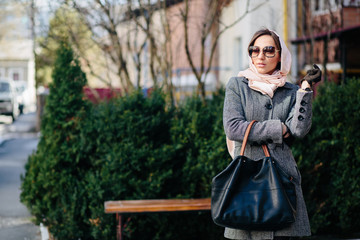 Happy young beautiful girl posing in the park