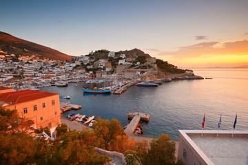 View of the port of Hydra at the sunset .