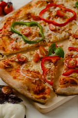 Delicious, freshly baked, homemade pizza with peppers, onions an