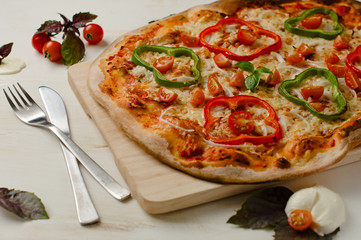 Delicious, freshly baked, homemade pizza with peppers, onions an