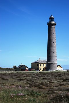 Skagen's Grey Lighthouse under blue sky, Denmark