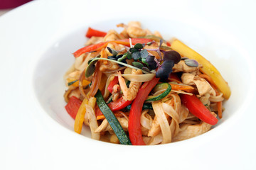 wok food - pasta with vegetables, shrimps and chicken