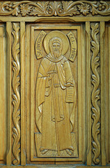 Carved detail of St Anthony on wooden door on Old Court Church,