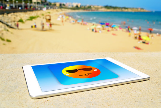 Icon Of A Sun Sweating In A Tablet Computer At The Beach