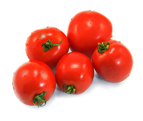 Few red tomatoes isolated on white