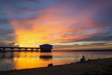 Reservoir Dokkrai(royal project of king bhumibol) over sunset and Silhouettes landscape view sunset Water reflection at 