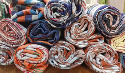 pile of fabric rolls