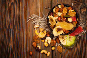 Dried fruits on wooden background