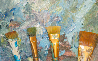 Paints brushes and oil paints