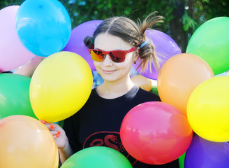 Girl with colorful balloons