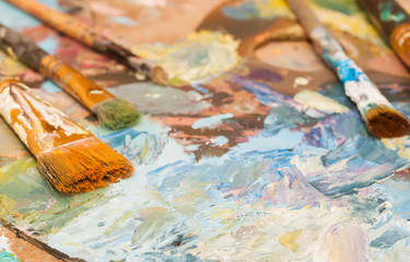 Fototapeta premium Paints brushes and oil paints