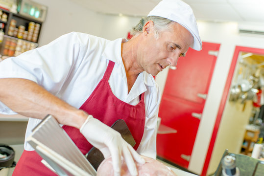 Man slicing meat