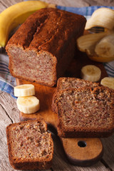 Homemade banana bread sliced on a table close-up. vertical