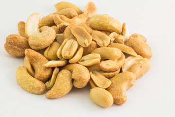 Cashew nuts and Peanuts in white background