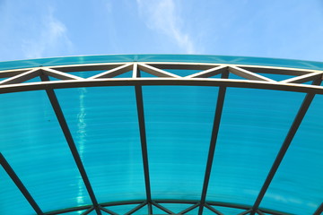 Arc polycarbonate canopy against a blue sky