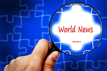 World news word. Magnifier and puzzles.