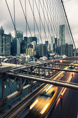 Obraz na płótnie Canvas Taxi cab crossing the Brooklyn Bridge