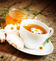 Black tea with chamomile, honey and marshmallow, selective focus