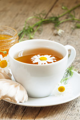Black tea with chamomile, honey and marshmallow, selective focus