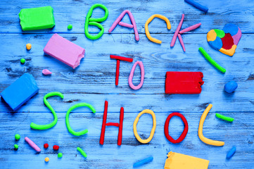 back to school written with modelling clay of different colors