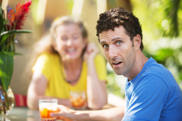 Dumbfounded Man with Woman on Vacation