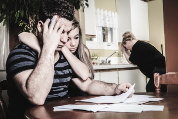 men with financial stress at home