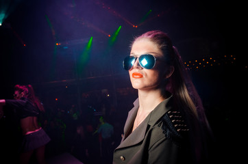Girl in sunglass. The club