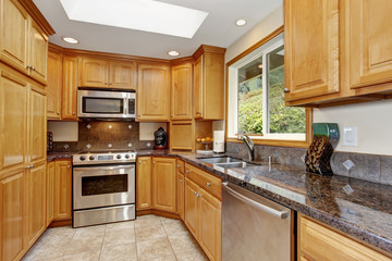traditional kitchen with island and tile floor.